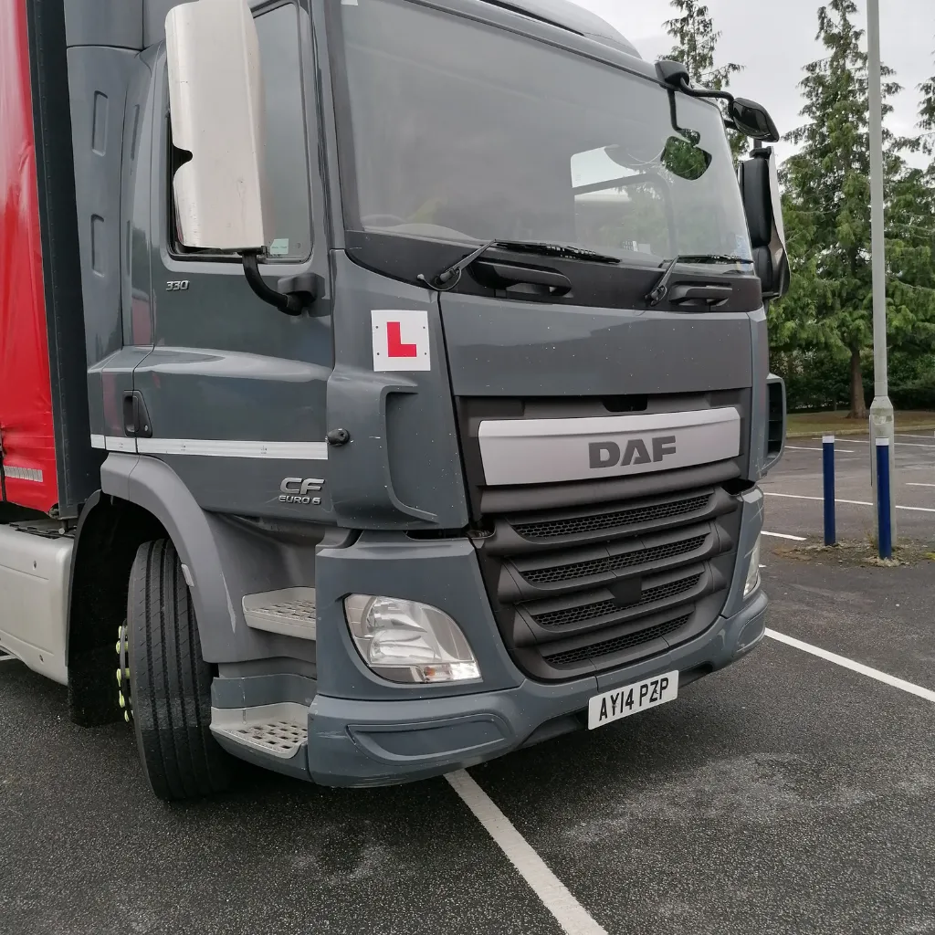A large truck parked in a parking lot.